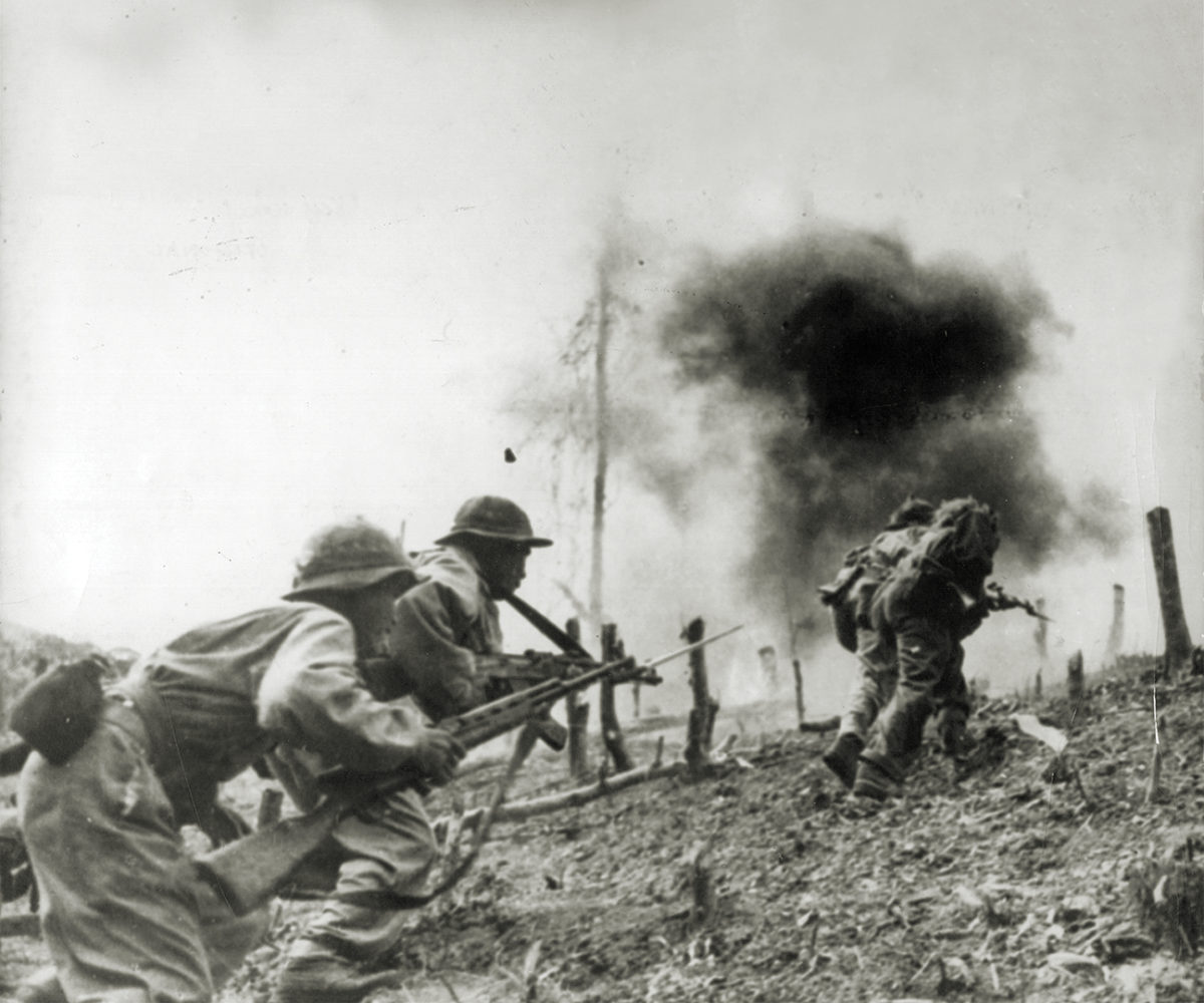 Photo of North Vietnamese troops during an assault on a South Vietnamese paratroop base at Laos during the Vietnam War.
