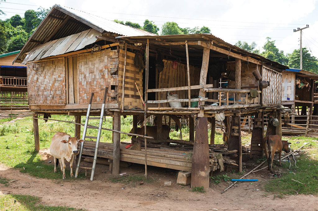 Photo of a house supported by cluster bomb cases. Note the ladder, which is made from alloy tubes used to deploy bomblets. Khammouane, Laos