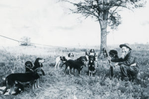 Ben Lilly with group of hounds