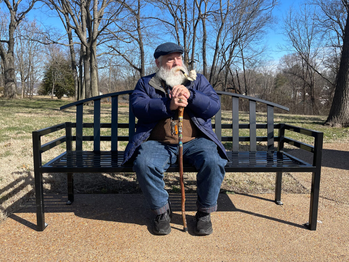 Chuck Burn sitting on park bench