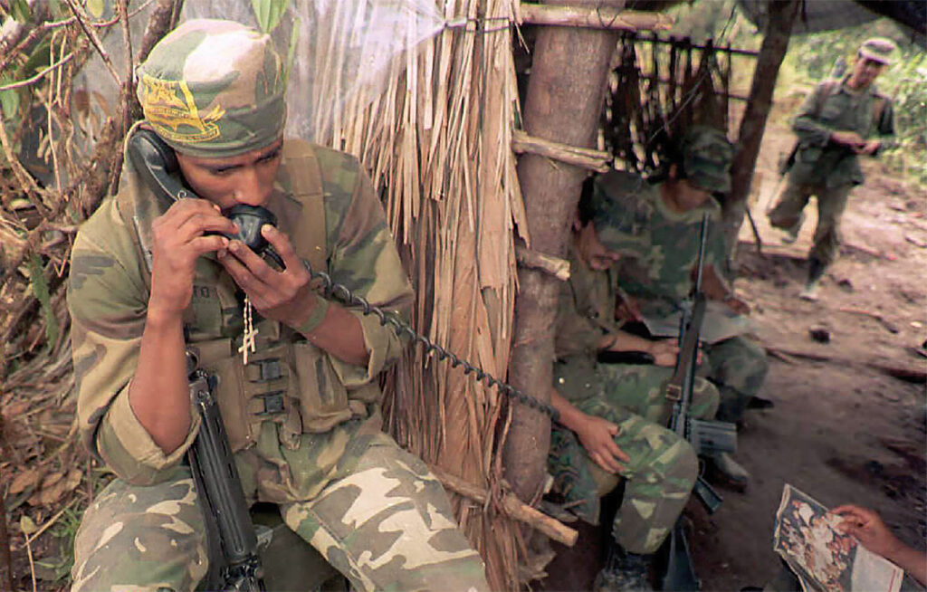 Photo of an Ecuadoran soldier speaking on a military phone 13 February in the conflict zone near Gualaquiza on the Ecuador/Peru border. Peru announced late 13 February a unilateral ceasefire in its border conflict with Ecuador.