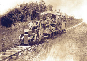 Photo of men testing an electric train in Thomas Edison experimental laboratory. Menlo Park, 13th May 1880.