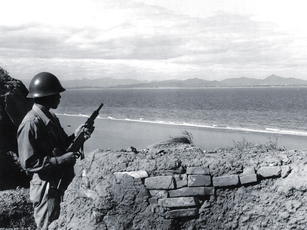 photo of A Nationalist sentinel on the Island of Quemoy watching the Communists' positions on the shore of Mao Tse-tun's China. Kinmen, November 1954