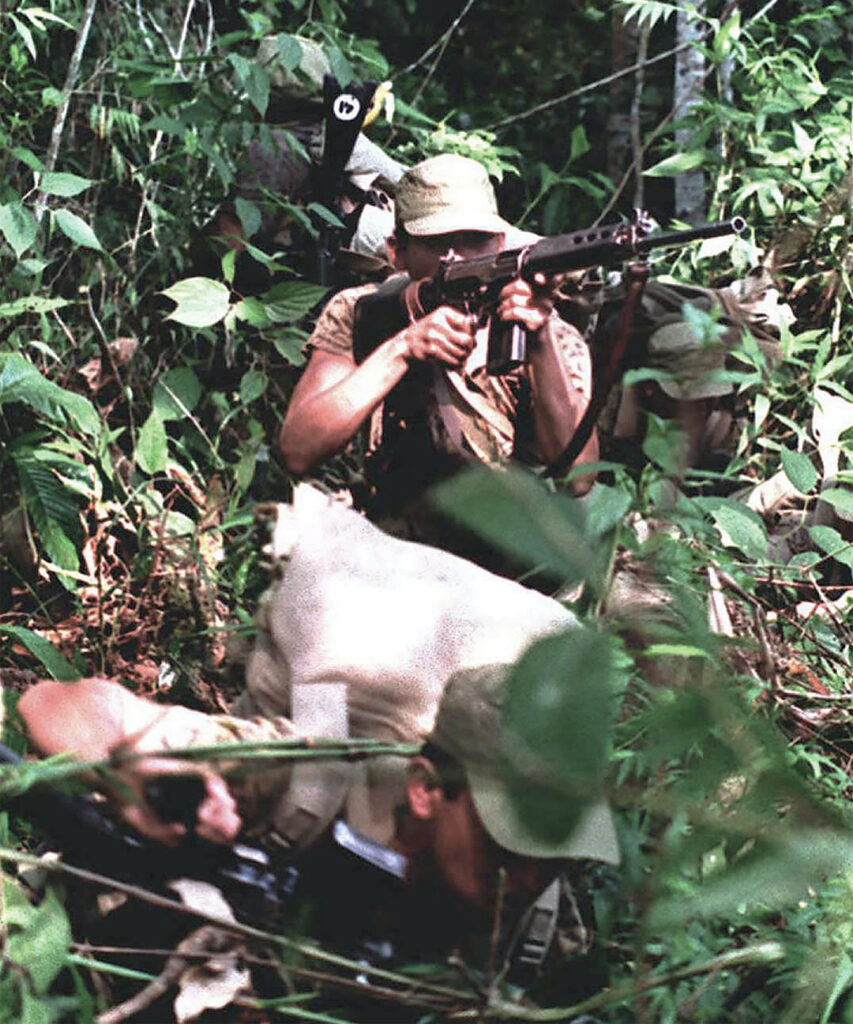 Photo of Peruvian army soldiers patrol the Cordillera del Condor area of the Amazon 10 February on the Peruvian side of the Peru/Ecuador border. The conflict has intensified in the ill-defined border area between the two countries and no diplomatic solution has reportedly been reached.