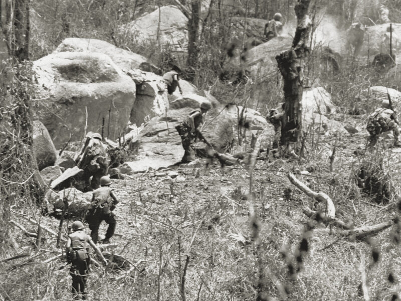 Photo of U.S. Marines are being fired upon as they charge entrenched troops of North Vietnam’s 2nd division on hill 441, near Hiep Duc Valley, South Vietnam on August 26, 1969.