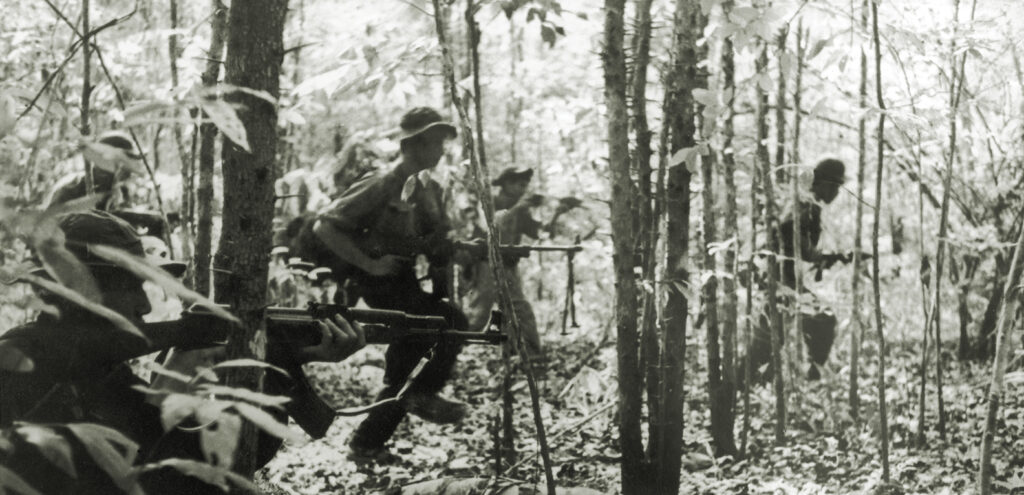 Photo of a Viet Cong detachment going into battle during the Vietnam War, January 1967.