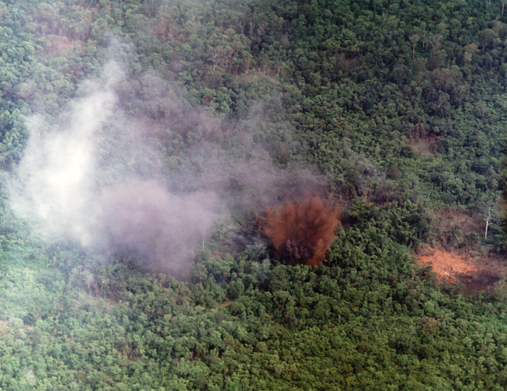 Photo of a FAC playing an instrumental role in this air strike northwest of An Loc in September 1969, in which a 500-lb. bomb killed an estimated 12 enemy soldiers, destroyed 44 bunkers, and exposed additional enemy bunkers and resources.