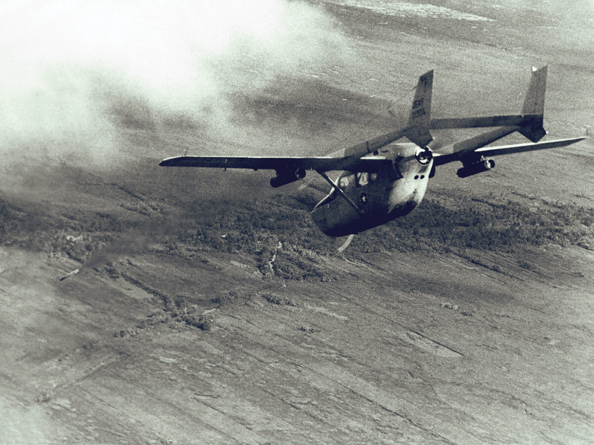 Photo of a O-2A Super Skymaster, used as a FAC aircraft, fires a smoke rocket at an enemy stronghold. The smoke rocket will mark the area for strike aircraft. Fast reaction time and increased time over target, plus the safety factor of its two engines make the O-2 ideal for both psychological warfare and FAC missions.
