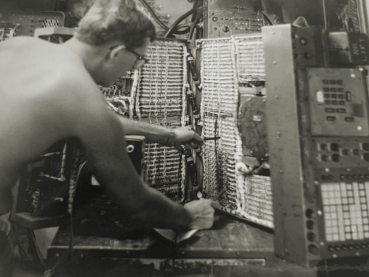 Photo of, author Paul Ingevaldson working on an M18 Field Artillery Digital Automatic Computer (FADAC) used for gun targeting in Vietnam.