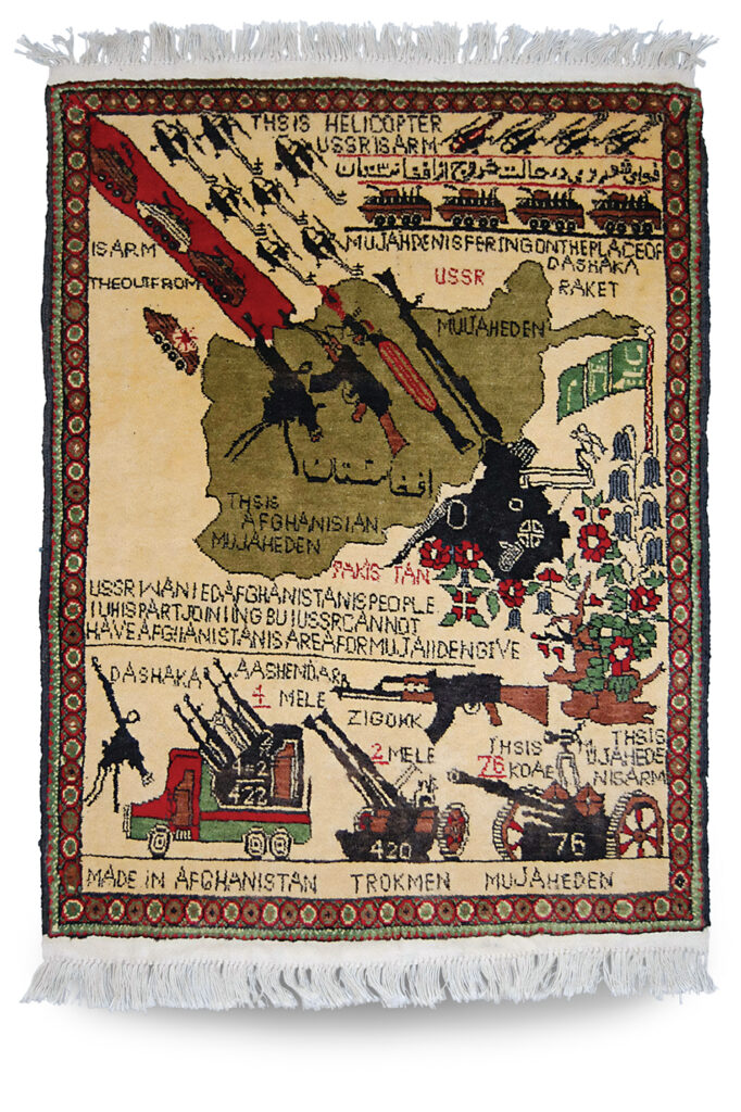 Photo of a woven Afghan rug telling a different story, with anti-aircraft guns at bottom and small arms at center chasing the Soviets back north.