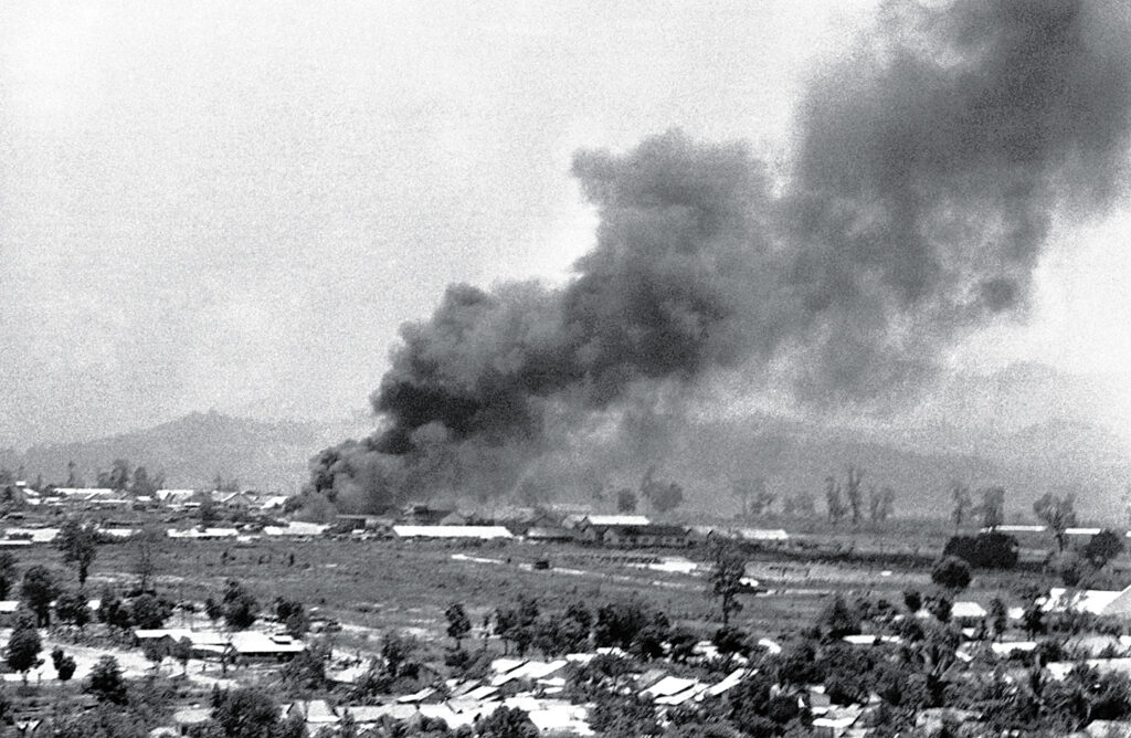 Photo of smoke and dust rising from bombs dropped by U.S. B52's on May 19, 1972, less than two miles in front of their lines on route 13 in South Vietnam. The South Vietnamese forces are trying to link up with besieged government troops at An Loc, a provincial capital north of Saigon.