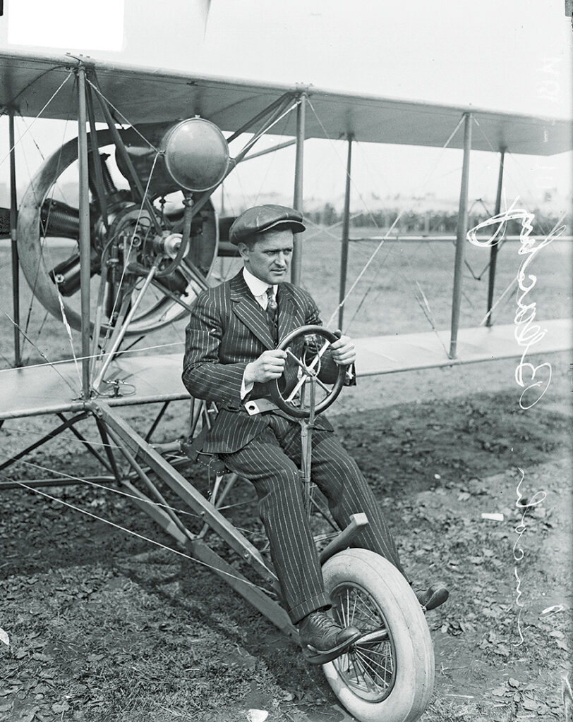 Photo of Lincoln Beachey sitting in an airplane on a dirt field, Chicago, Illinois, July 1, 1914.