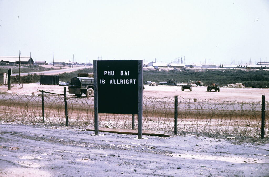 Photo of the Phu Bai combat base was spartan in terms of clubs and post exchange services, but its gate sign proclaimed it “all right” with two L’s for emphasis.
