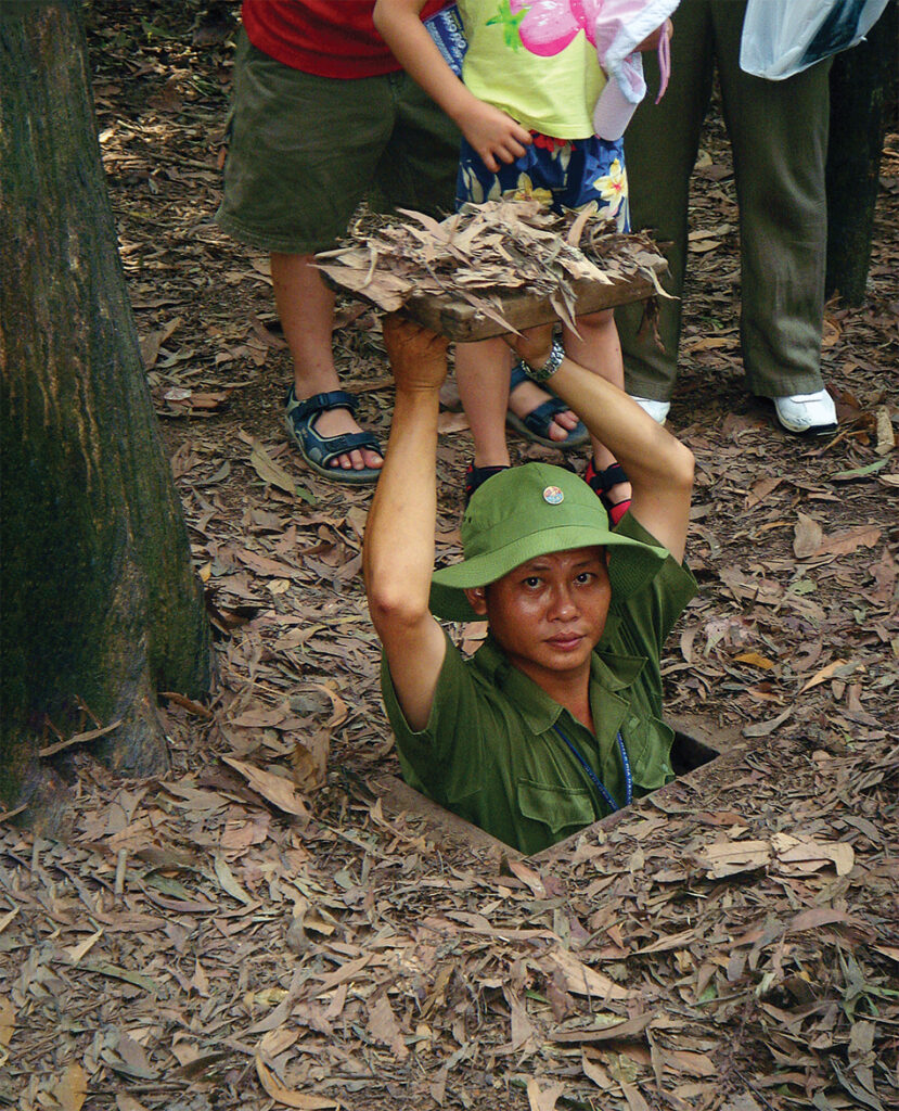 Photo of a Vietnam Entrance into a tunnel from Cu Chi.