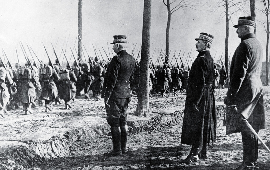 Photo of Commander-in-Chief of the Allied Forces in WW 1 French troops parading past Marshal Ferdinand Foch.