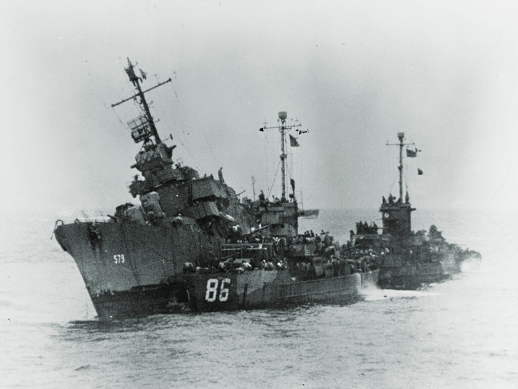 Photo of LCS-86 and LCS-122 rescue crewmen from the kamikaze-stricken destroyer William D. Porter.