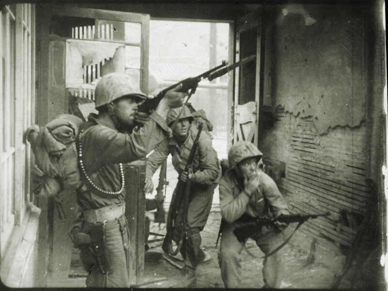 Photo of U.S. Marines engage in a street fight amid the September 1950 battle to retake Seoul, the capital of South Korea.