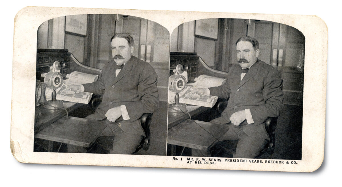 Stereographic view of R.W. Sears at desk.