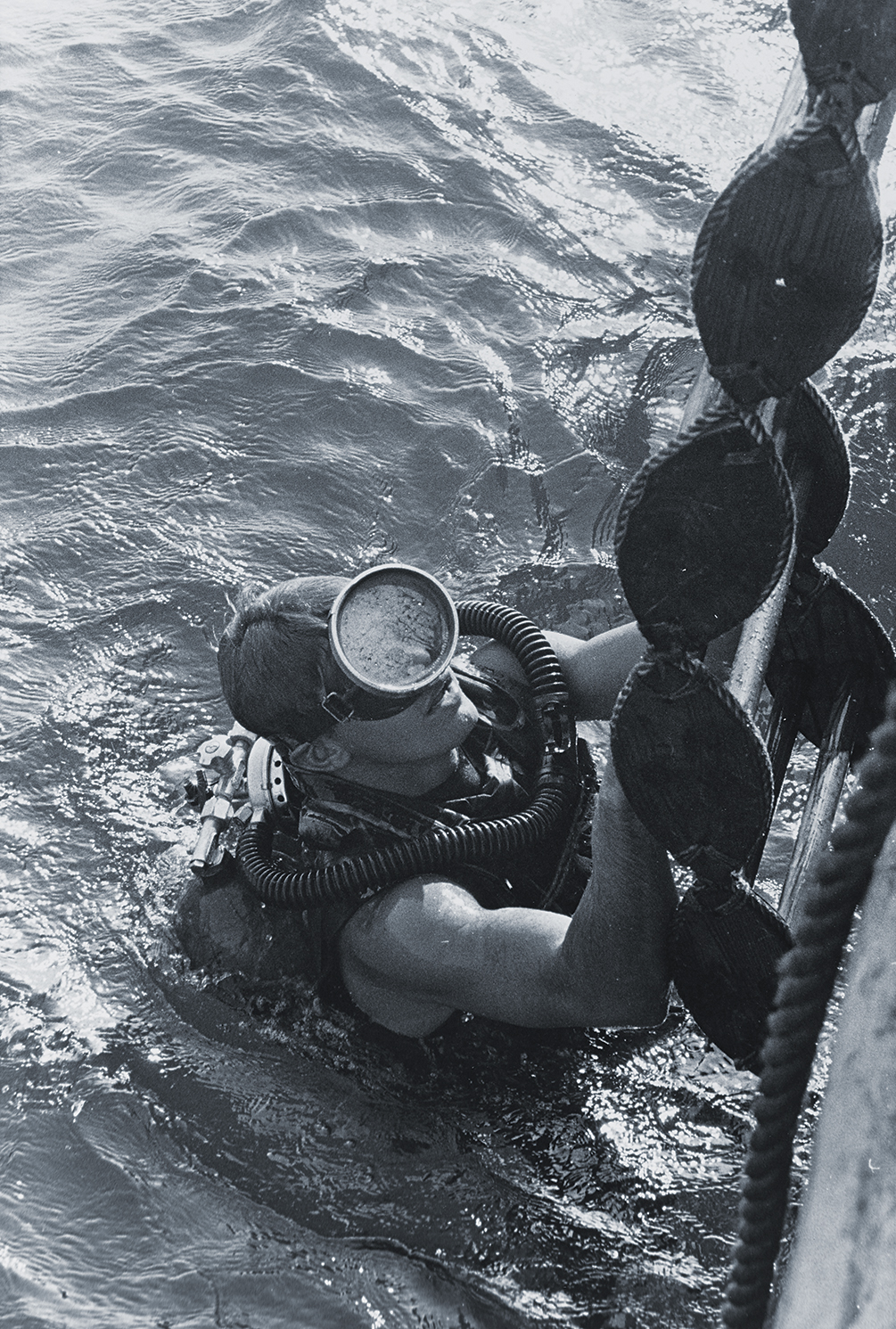 Photo of a U.S. Navy SEAL surfacing from a dive. SEALs and UDT divers were tasked with getting ashore and guiding the POWs to safety.