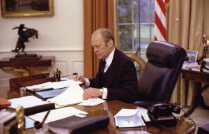 Photo of Gerald Ford at work in the Oval Office in January 1976.