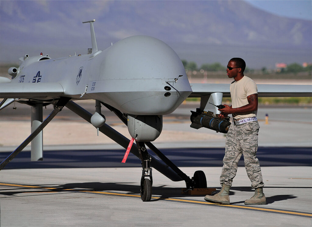 Photo of a dedicated crew chief preparing an MQ-1B remotely piloted aircraft for a training mission, May 13, 2013. The MQ-1B Predator is an armed, multi-mission, medium-altitude, long-endurance remotely piloted aircraft that is employed primarily as an intelligence-collection asset and secondarily for munitions capability to support ground troops and base defense.