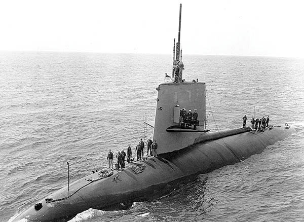 Scorpion crewmen come topside in April 1968 as the sub nears another American ship.
