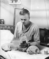 Cleland in Walter Reed Hospital in 1968, reading "A Thousand Days," by Arthur Schlesinger Jr. (Courtesy Simon & Schuster)