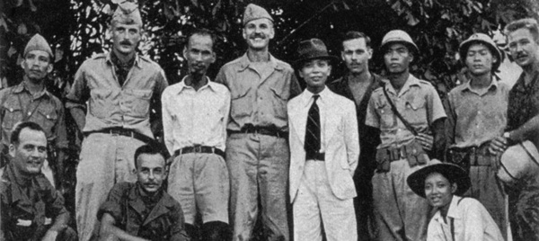 OSS Deer Team members pose with Viet Minh leaders Ho Chi Minh and Vo Nguyen Giap during training at Tan Trao in August 1945. Deer Team members standing, l to r, are Rene Defourneaux, (Ho), Allison Thomas, (Giap), Henry Prunier and Paul Hoagland, far right. Kneeling, left, are Lawrence Vogt and Aaron Squires. (Rene Defourneaux)