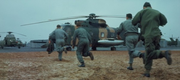 Air Force Pararescue team members race to their HH-3 Jolly Green Giant, as Sgt. Charley Smith's crew did at their secret base in Laos on November 5, 1967, upon learning that Capt. Bill Sparks had bailed out of his F-105 75 miles north of Hanoi. (U.S. Air Force/National Archives)