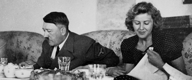 Hitler dines with Eva Braun, his longtime companion. (National Archives)