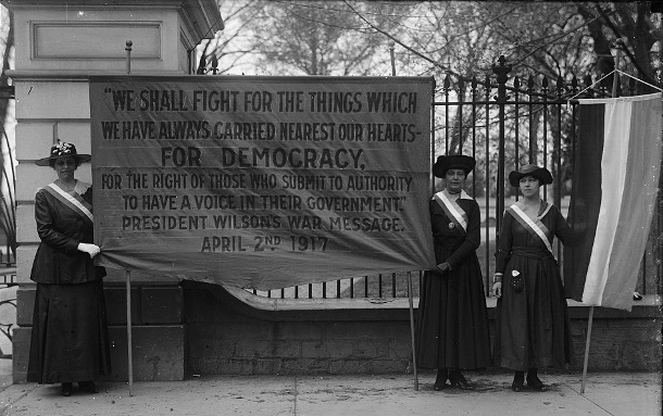 Suffragists picket the White House in 1917 to remind President Woodrow Wilson of his wartime pledge to fight for democratic principles. (Library of Congress)