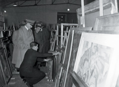 Hitler examines a cache of paintings. It’s estimated that Nazi Germany looted one-fifth of Europe’s art during World War II (Photo: National Archives).