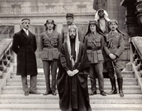 The Arabian delegation to the Paris Peace Conference in early 1919 included Emir Feisal Hussein (Front, center) and an already disillusioned Lawrence (third from right). He would use his fame to launch a campaign to force Britain to honor its wartime pledges to restore Arab rule (National Archives).