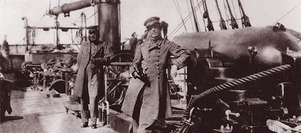 Captain Semmes, at center, and first officer Lieutenant John McIntosh Kell pose aboard the raider CSS Alabama. (Naval History and Heritage Command)