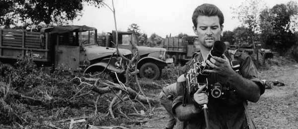 Stringer Don North adjusts his new camera during the August 1965 fight for Duc Co. South Vietnamese losses were heavy, and North scored an exclusive with his film footage. (Photo: Don North)