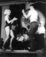 Joey Heatherton dances the "Watusi" with a serviceman aboard USS Roosevelt during the 1966 tour.