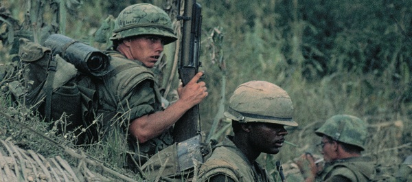 Marines of 1st Battalion, 3rd Regiment set security at an abandoned enemy bunker on May 4, 1968, near Dai Do, where North Vietnamese Army ambushes killed dozens of Marines. (National Archives)