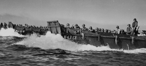 Landing craft designed by Andrew Jackson Higgins ferried troops to the Battle of Luzon, January 9, 1945. (National Archives)