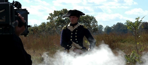 Special-effects smoke rises around Matthew Keagle, portraying the Marquis de Lafayette in 'Lafayette: Forgotten Hero. Courtesy Thomas Beckner - Storyville Films
