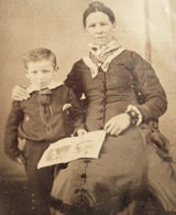 Young Wyatt with his mother. He became a constable in Lamar, Mo., in 1869 before moving on to Wichita, Dodge City, and Tombstone. His famous 1881 "Gunfight at the O.K. Coral" in Tombstone would haunt Earp for the remainder of his life. Courtesy John Rose.