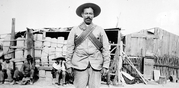 Mexican revolutionary General Pancho Villa, above in battle garb and bandoliers, dressed up for scenes in his 1914 semiautobiographical silent film. (Photo from Library of Congress)