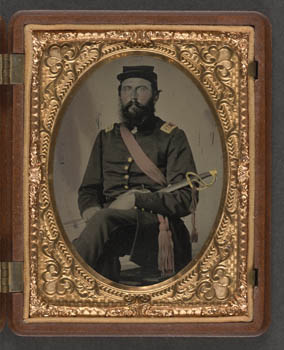 An unidentified soldier in a Union Captain uniform wears a crimson sash while holding a cavalry saber (Liljenquist Family collection/Library of Congress).