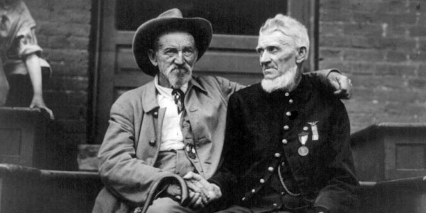 At a Battle of Gettysburg reunion in 1913, former adversaries shake hands. But which was in the "army of the rebellion"? (Library of Congress)