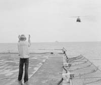 As hundreds of helicopters carrying refugees desperately fled Saigon on April 30, 1975, Kirk's Commander Paul Jacobs decided to signal some to land on the ship's deck.
