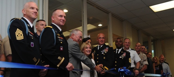 President of USO of Metropolitan D.C., Elaine Rogers (center), stands with the president and CEO of Harkins Builders, Richard M. Lombardo (left) and Army Major General Karl Horst, commanding general of Joint Force Headquarters—National Capitol Region and The U.S Military District of Washington in a ribbon-cutting ceremony, September 8, 2010. (USO photo by Joe Lee)