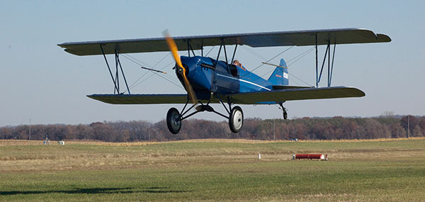 Eric Berens' Travel Air 2000 makes its first flight since 1937. The Model 2000's superficial resemblance to the Fokker D.VII earned it a role in Howard Hughes' "Hell's Angels." [Image: Jim Weeden]