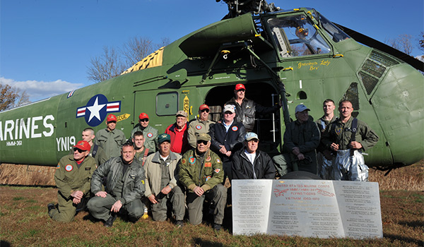 Veterans of HMM-361 pose with the restored Sikorsky UH-34D they presented to the National Museum of the Marine Corps. [U.S. Marine Corps]