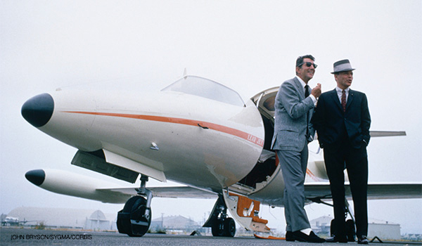 Rat Pack stalwarts Dean Martin and Frank Sinatra lent Lear's private jet an invaluable aura of cool during the mid-1960s. [John Bryson/Sygma/Corbis]