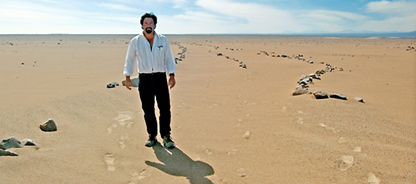 Charles Stanish, UCLA archaeologist and professor of anthropology, stands on the site of a 14th century irrigation canal in the high desert of northern Chile. (Courtesy of Ran Boytner)