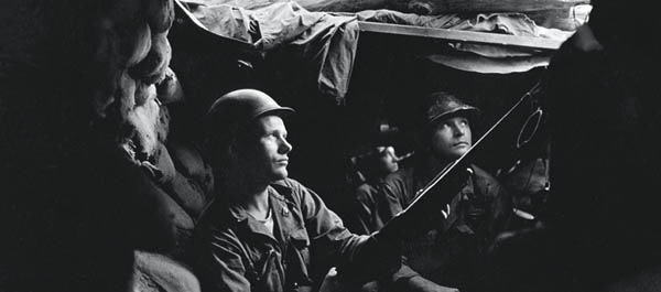 U.S. infantrymen in Korea take cover in a tunnel while they wait for orders and “sweat it out”—one of many phrases used commonly in the Korean War but born of an earlier era. (U.S. Army/National Archives)